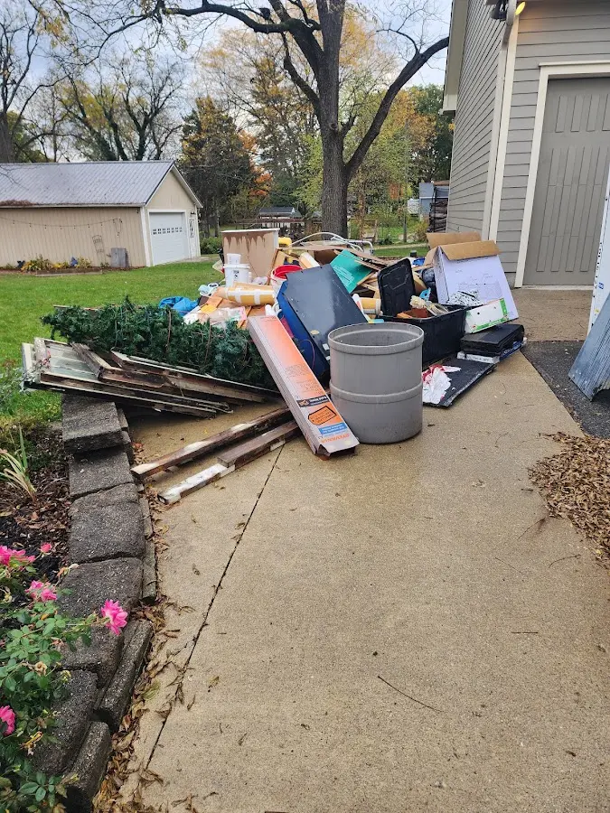 Dumpster being loaded with debris for Commercial Dumpster Rental in EspaÃÂ±ola